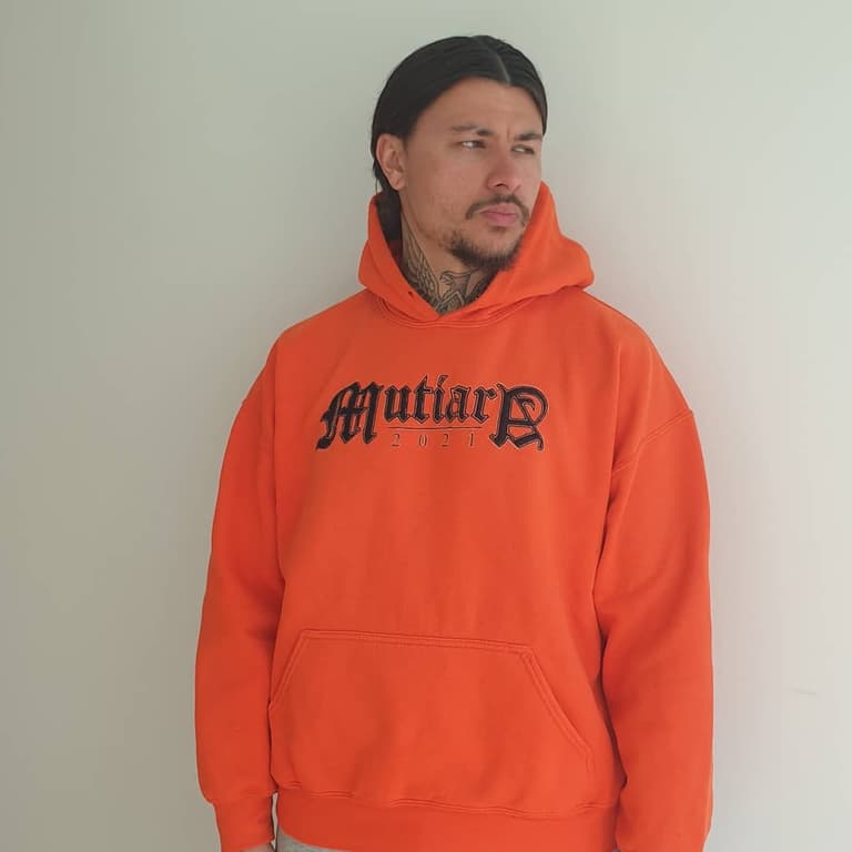 Portrait photo of an embroidered hoodie for a barber that went by Mutiara